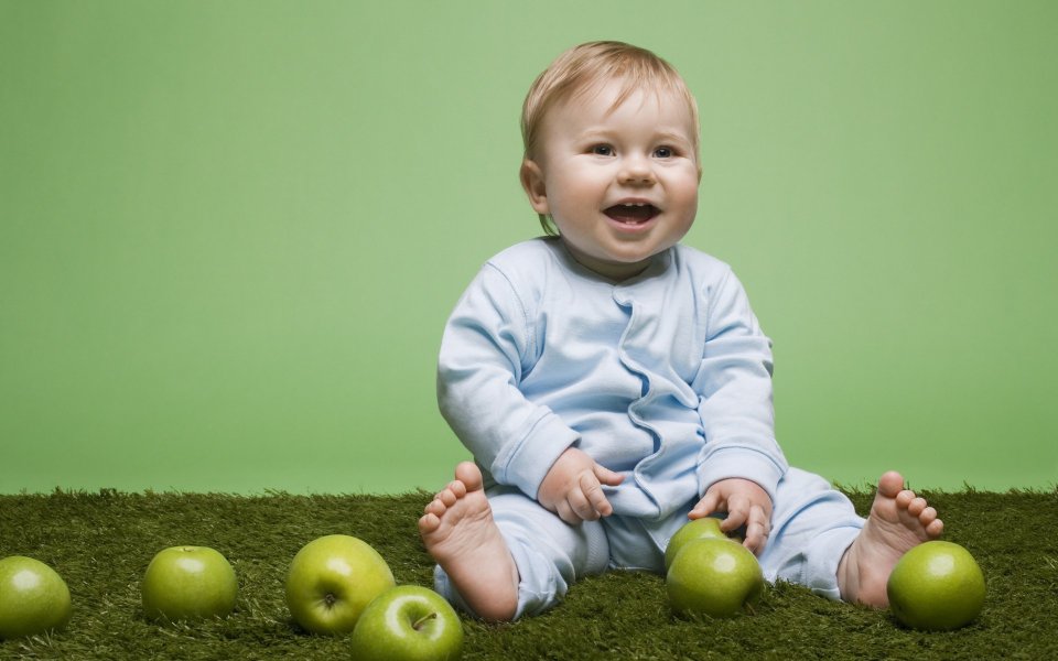 Cute Baby Sitting On Lawn Playing Green Apples Photography