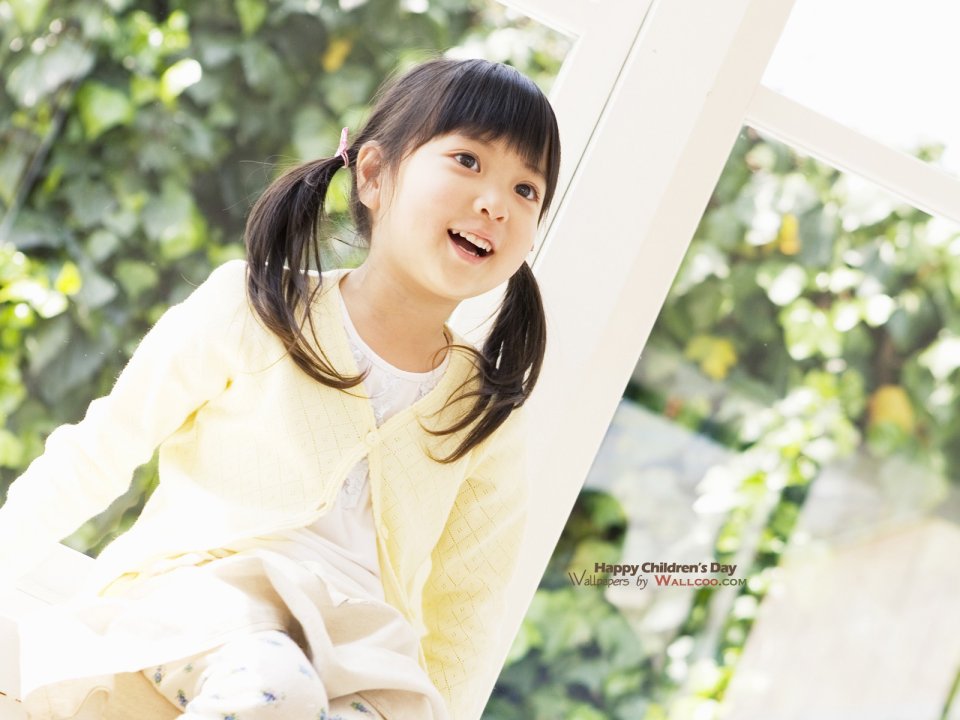 Smiling Cute Asian Little Girl By Window Childrens Day Photo