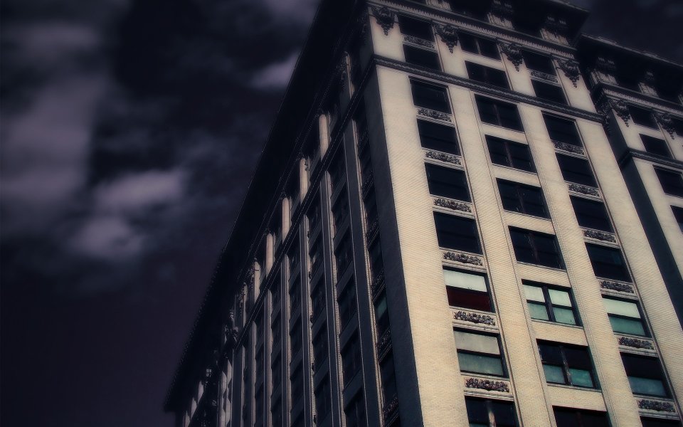 Gloomy Vintage Skyscraper At Night