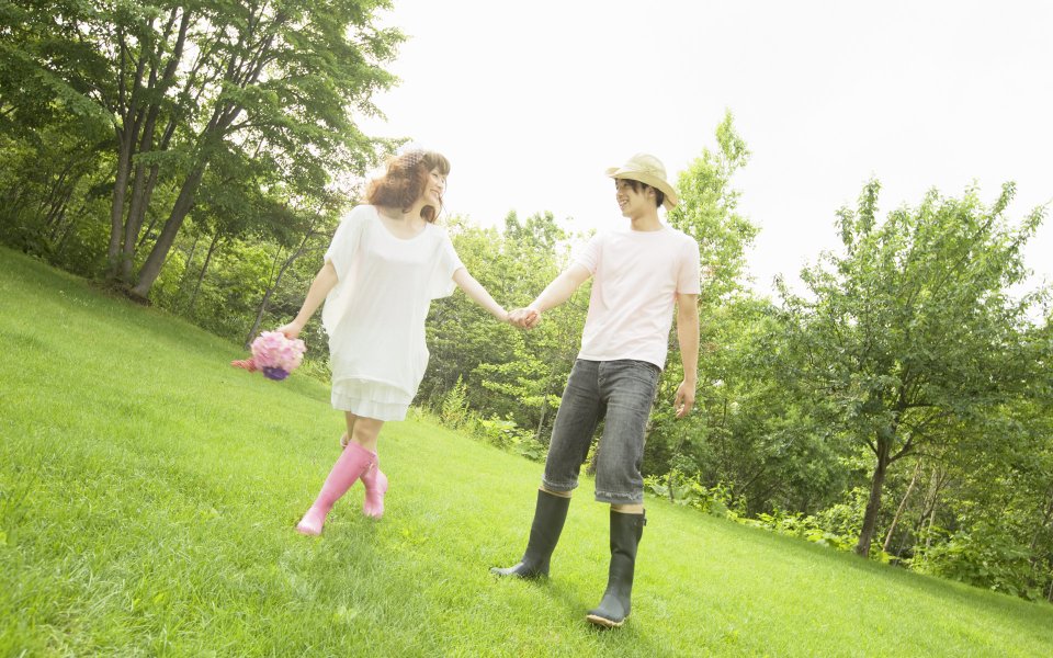 Fresh Garden Wedding Photo Couple Walking Hand In Hand On Lawn