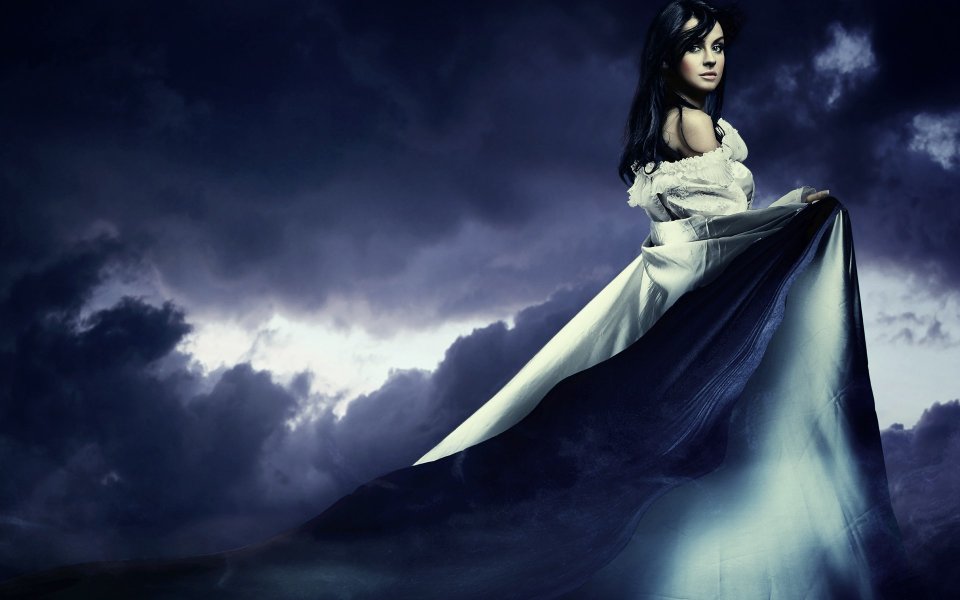 Fantasy Portrait Of Black Haired Woman With Long Dress Under Dark Purple Clouds