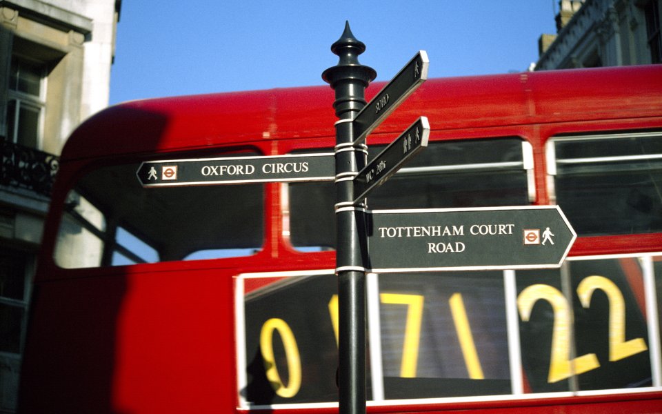 London Street Red Double Decker Bus And Signpost