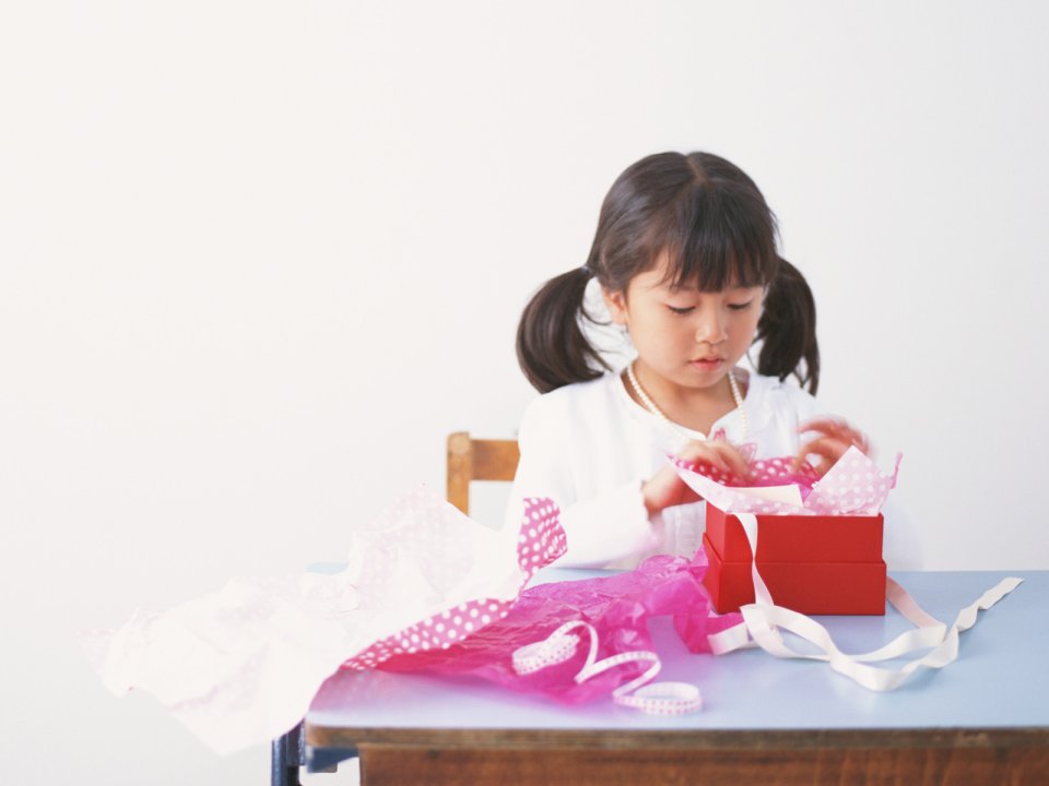 Little Girl Unwrapping Red Gift Box Warm Daily Photo