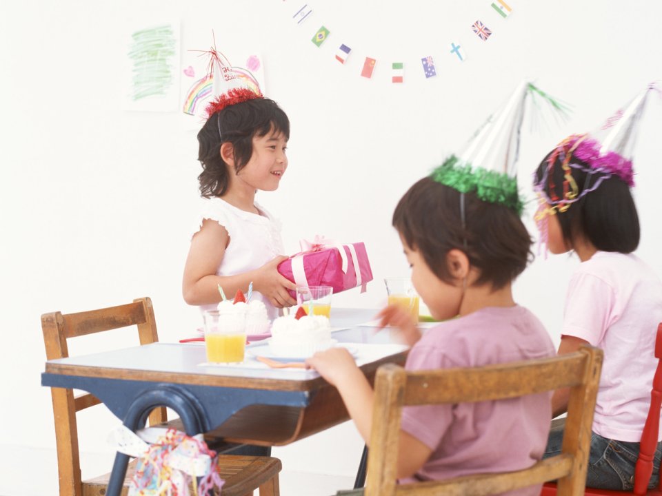 Little Girls Indoor Birthday Party Warm Celebration Scene