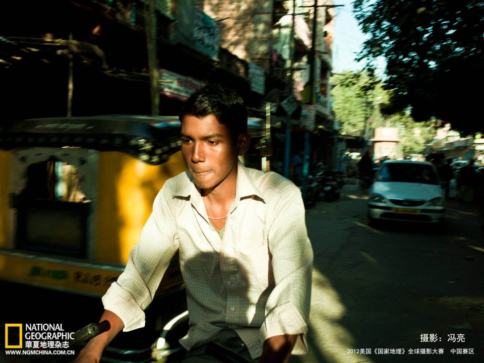 Young Rickshaw Driver On India Old City Street Documentary Photo