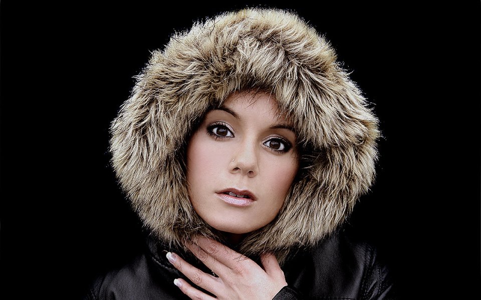 Woman In Fur Hood Leather Jacket Studio Portrait