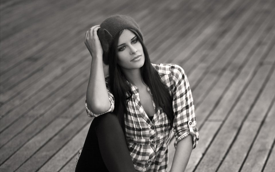 Black And White Portrait Of Casual Young Woman On Wooden Platform