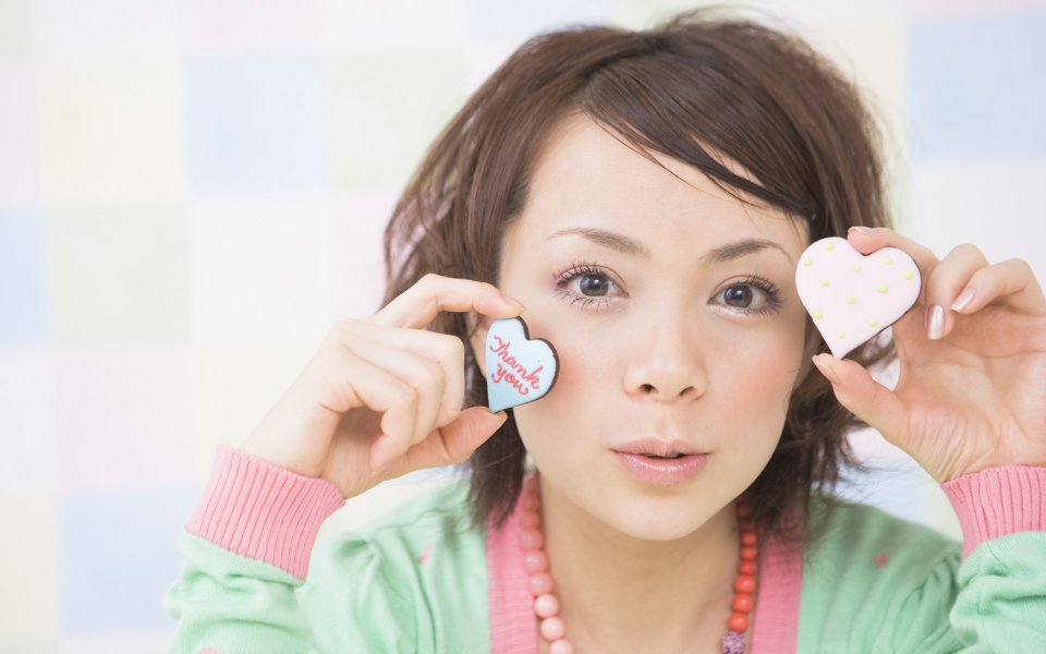 Cute Japanese Girl Holding Heart Shaped Thank You Cookies Portrait