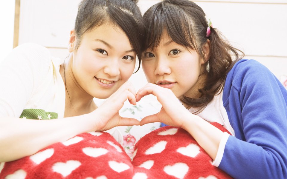 Two Asian Best Friends Making Heart Gesture Home Portrait