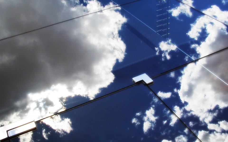 Blue Sky Reflection On Skyscraper Glass Facade