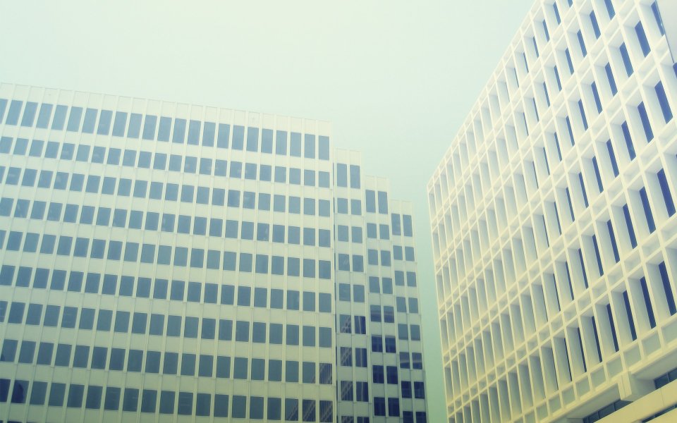 Vintage Film Style Low Angle Shot Of Modern Office Buildings
