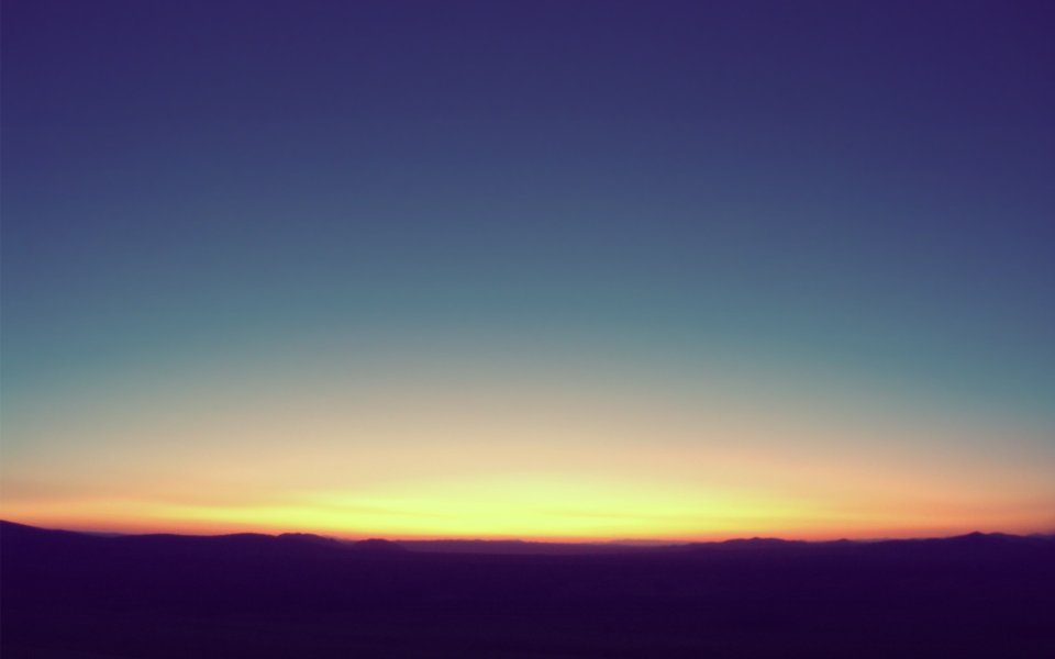 Sunset Gradient Sky Over Wilderness Mountain Silhouette
