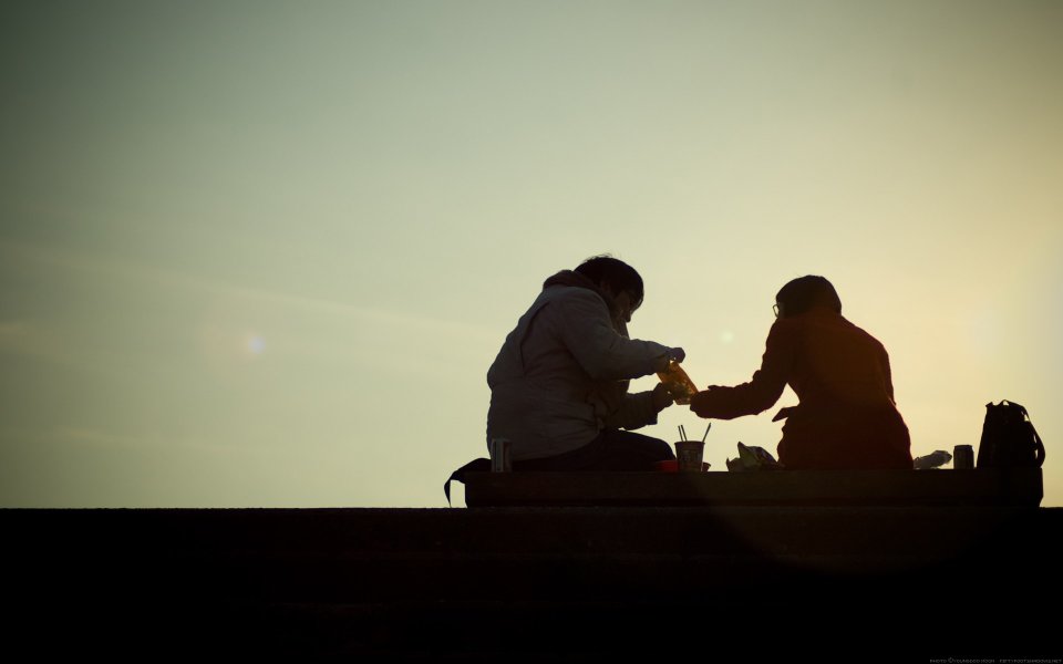 Couple Silhouette Toasting At Sunset Outdoor Picnic