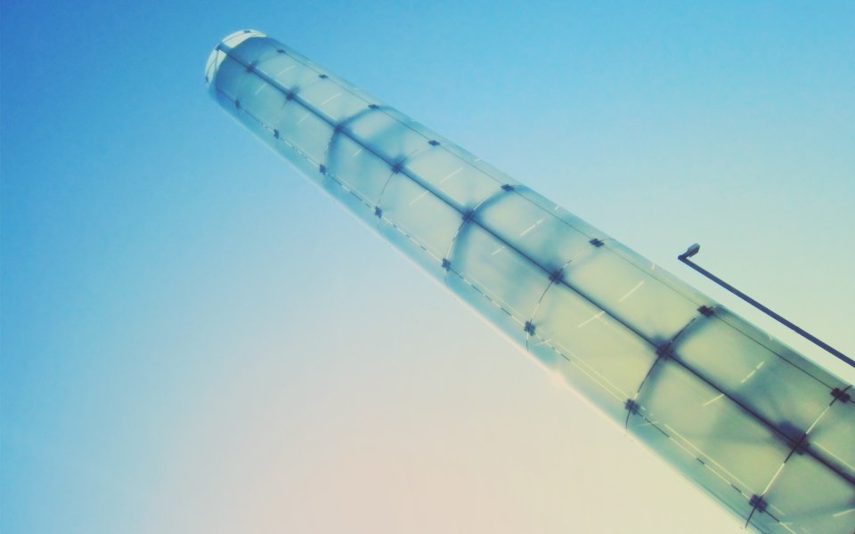 Low Angle Shot Of Glass Tower Under Clear Blue Sky