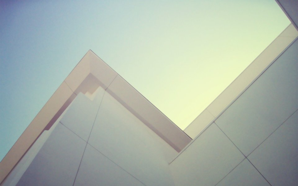 Low Angle View Of Modern Geometric Building With Gradient Sky