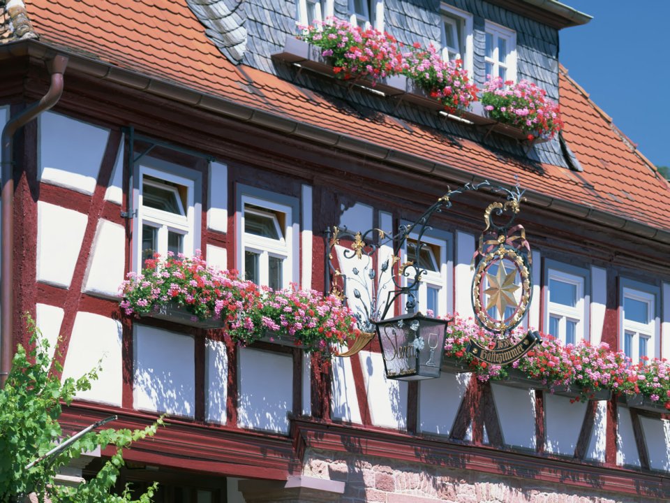 German Traditional Half Timbered House With Window Flower Decorations