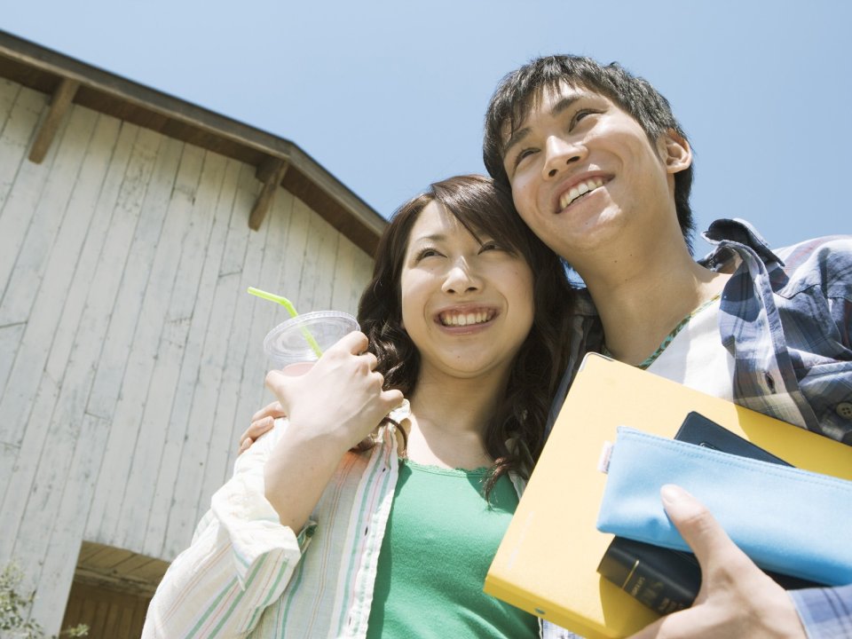 Happy Young Student Couple Outdoor On Sunny Summer Day