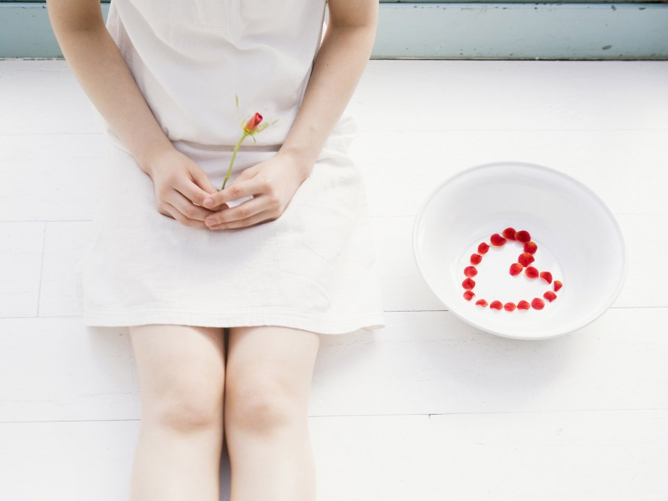 Fresh Photo Of Girl In White Dress Holding Rose Bud With Heart Petals