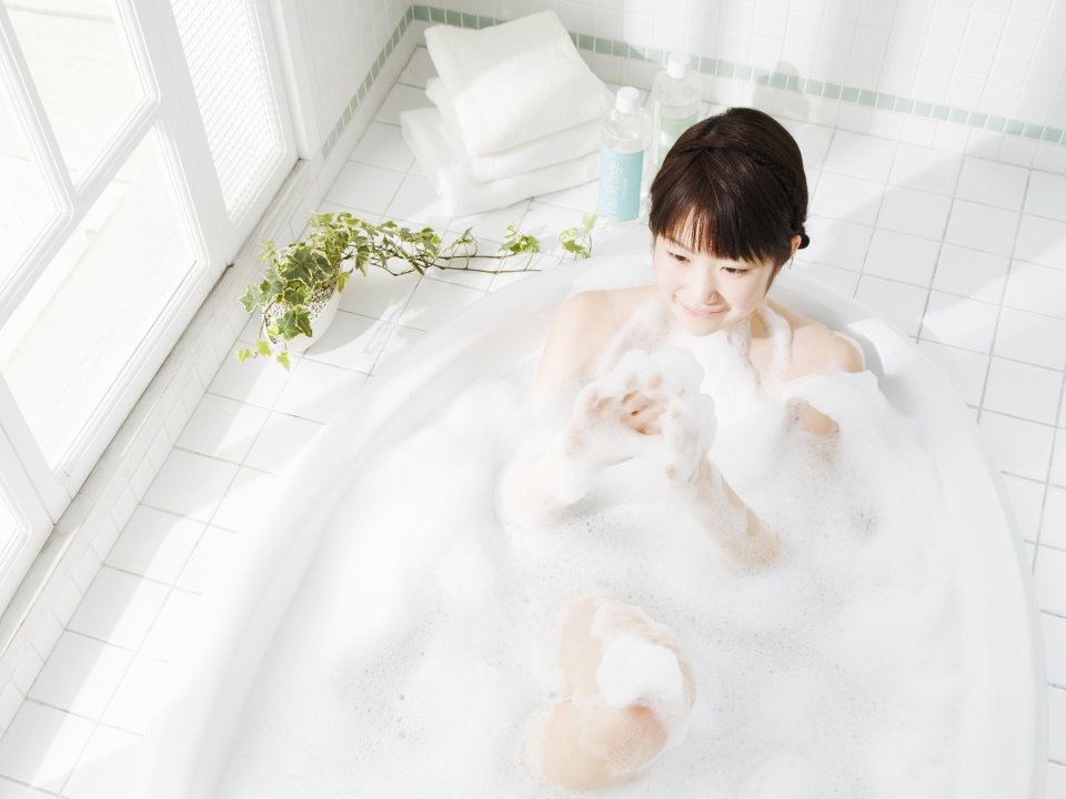 Fresh Japanese Girl Enjoying Bubble Bath In Sunny Bathroom