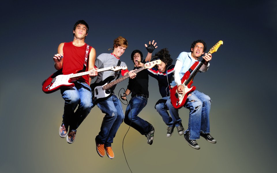 Energetic Young Rock Band Jumping Together Creative Photography