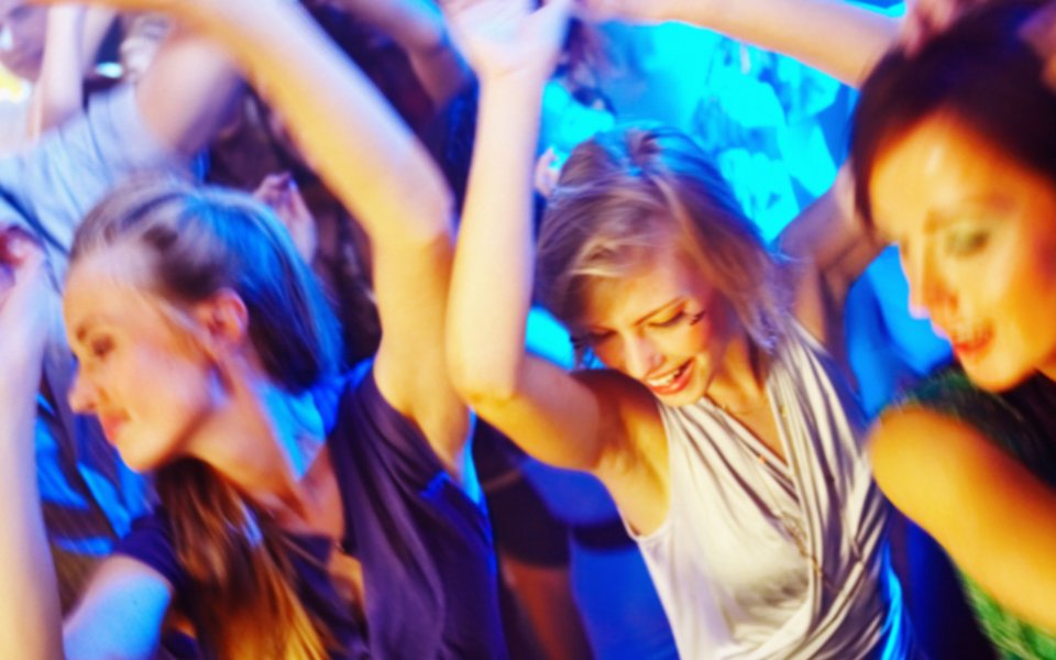 Young People Dancing Crazily At Nightclub Party