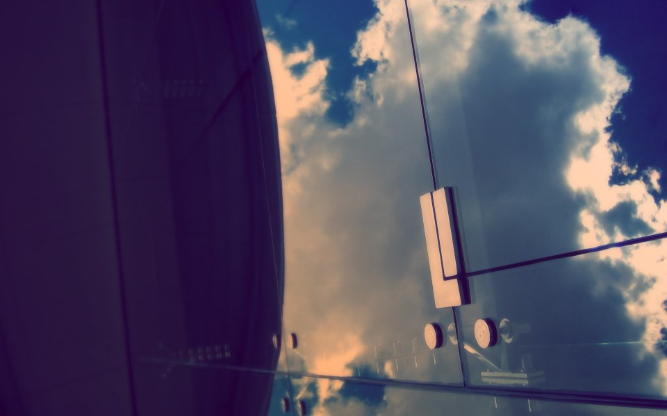 Reflection Of Blue Sky On Modern Glass Facade
