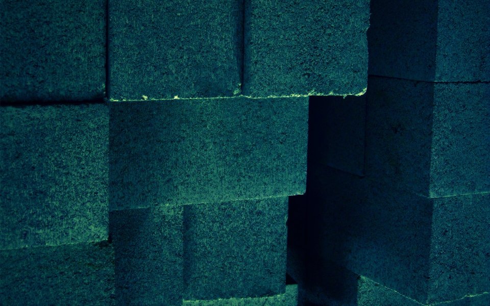 What Lies Beneath Dark Teal Staggered Brick Wall Texture Closeup
