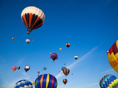 Colorful Hot Air Balloons Flying Under Clear Blue Sky