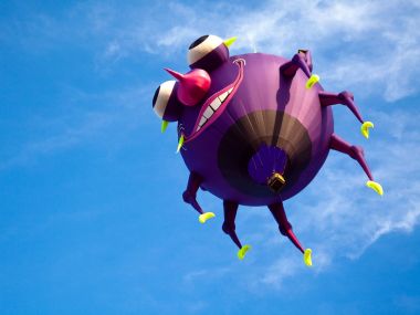 Purple Cartoon Monster Shaped Hot Air Balloon Under Blue Sky