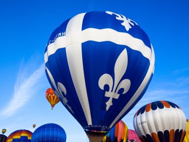 Quebec Hot Air Balloon Festival Flying Balloons Under Blue Sky