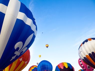 Colorful Hot Air Balloons Flying Under Clear Blue Sky