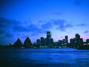 Sydney Opera House And City Skyline At Night