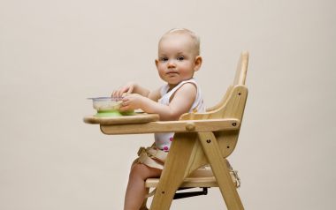 Cute Baby Sitting On Wooden High Chair Eating Food Photography