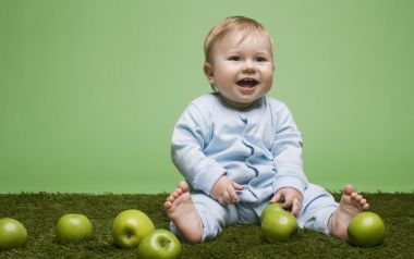 Cute Baby Sitting On Lawn Playing Green Apples Photography