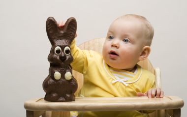 Cute Baby Touching Easter Chocolate Bunny Photography