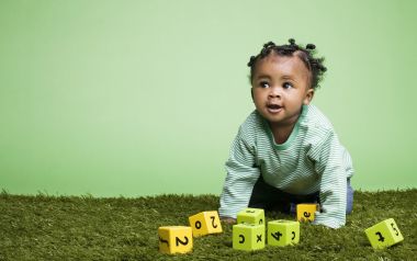 Cute Black Baby Playing With Educational Blocks Portrait