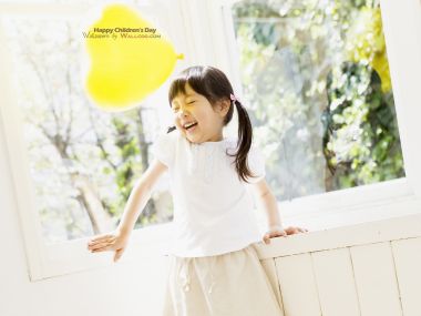 Happy Little Asian Girl Playing Yellow Heart Balloon Childrens Day