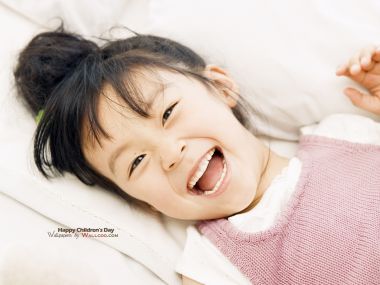 Happy Laughing Cute East Asian Little Girl Childrens Day Portrait