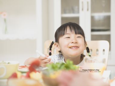 Smiling Asian Little Girl Eating At Home Childrens Day