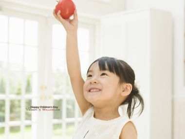 Cute Asian Little Girl Holding Red Tomato Warm Home Photo