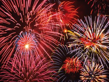 Vibrant Fireworks Display On Dark Night Sky