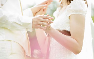 Outdoor Garden Wedding Couple Exchanging Rings Closeup