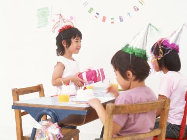 Little Girls Indoor Birthday Party Warm Celebration Scene