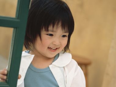Cute Little Girl With Missing Tooth Warm Film Portrait