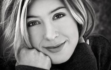 Black And White Portrait Of Elegant Woman Resting Chin Smiling