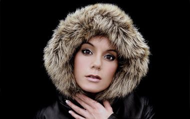Woman In Fur Hood Leather Jacket Studio Portrait