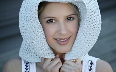 Smiling Young Woman With White Hollow Straw Hat Portrait