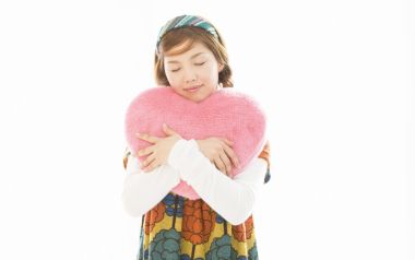 Sweet Japanese Girl Hugging Fluffy Pink Heart Pillow