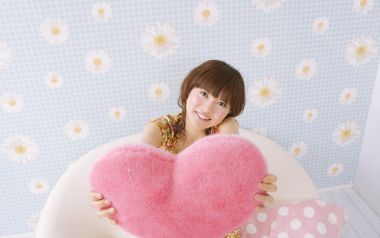 Sweet Young Girl Holding Pink Heart Pillow Home Portrait