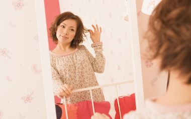 Japanese Home Girl Adjusting Hair In Front Of Mirror Warm Photo